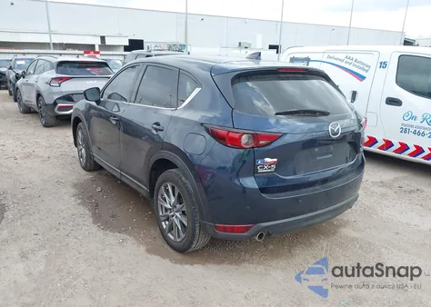 2021 Mazda Cx-5 Signature z USA, uszkodzony, nr VIN JM3KFBEY1M0343561